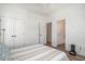 A cozy bedroom features natural light, a double closet, and a door to the adjoining bath at 1002 Carmela Ct, North Charleston, SC 29405