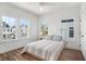Bright bedroom featuring three windows and a ceiling fan, showcasing natural light and a peaceful atmosphere at 1002 Carmela Ct, North Charleston, SC 29405