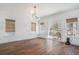 Bright dining area with sliding doors to the balcony and hardwood floors, perfect for Gathering meals at 1002 Carmela Ct, North Charleston, SC 29405