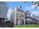 Charming three-story homes with decks and lush lawns at 1002 Carmela Ct, North Charleston, SC 29405