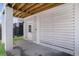 Ground floor garage with white plank siding and entry door at 1002 Carmela Ct, North Charleston, SC 29405