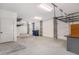 Spacious garage with ample storage shelves and a clean concrete floor for versatile use at 1002 Carmela Ct, North Charleston, SC 29405