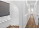 Hallway with stairs and wood floors and a window with blind at 1002 Carmela Ct, North Charleston, SC 29405