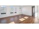 Spacious living room with wood floors, natural light, and crisp white walls, perfect for entertaining at 1002 Carmela Ct, North Charleston, SC 29405