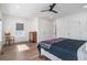 Tranquil main bedroom with a large bed, wood floors, windows, and a neutral color palette at 1002 Carmela Ct, North Charleston, SC 29405