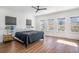 Main bedroom with three windows and a ceiling fan, showcasing natural light and a peaceful atmosphere at 1002 Carmela Ct, North Charleston, SC 29405