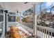Inviting covered porch with seating area and scenic neighborhood views at 1002 Carmela Ct, North Charleston, SC 29405