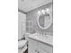 Bathroom featuring a vanity with marble countertop, a round mirror, and a tub with shower curtain at 105 Peacock Pl, Summerville, SC 29485