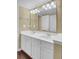 Bright bathroom with a white double sink vanity and a large mirror, offering ample space and functionality at 105 Peacock Pl, Summerville, SC 29485