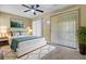 Bedroom has neutral tones and a large window for natural light and a comfortable, styled bed at 105 Peacock Pl, Summerville, SC 29485