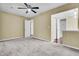 A bedroom in neutral colors leads to a bathroom and has basic carpet and wall paint at 105 Peacock Pl, Summerville, SC 29485