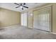 A room with sliding glass doors for natural light has neutral carpet and walls plus a ceiling fan at 105 Peacock Pl, Summerville, SC 29485