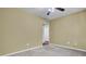 A basic bedroom with neutral carpet and walls leads to an adjacent bathroom at 105 Peacock Pl, Summerville, SC 29485