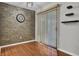 Cozy dining area with a stone accent wall and sliding glass door at 105 Peacock Pl, Summerville, SC 29485