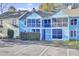 Colorful townhome complex with vibrant exterior, screened porches and mature trees at 105 Peacock Pl, Summerville, SC 29485