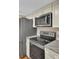 Modern kitchen with stainless steel appliances including refrigerator, microwave, and range at 105 Peacock Pl, Summerville, SC 29485