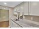 Bright kitchen features granite countertops, white cabinets, and stainless steel faucet at 105 Peacock Pl, Summerville, SC 29485