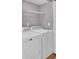 Functional laundry room equipped with washer and dryer and shelving at 105 Peacock Pl, Summerville, SC 29485