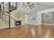 Open-concept living room featuring a spiral staircase, fireplace, and wood floors at 105 Peacock Pl, Summerville, SC 29485