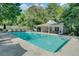 Well-maintained community pool with a clubhouse and ample seating for residents at 105 Peacock Pl, Summerville, SC 29485