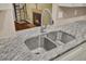 Close-up of the kitchen sink with stainless steel faucet and granite countertop at 105 Peacock Pl, Summerville, SC 29485