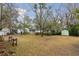 Backyard with large shed, and a bench for enjoying the scenery at 105 S Palmetto St, Summerville, SC 29483
