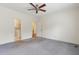 Bedroom featuring carpet flooring and doorways leading to bathroom and hallway at 105 S Palmetto St, Summerville, SC 29483