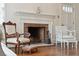 Close-up of the living room fireplace with classic trim, adding warmth and charm to the living space at 105 S Palmetto St, Summerville, SC 29483