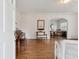 Elegant foyer featuring hardwood floors, classic trim, with views into the living room and dining room at 105 S Palmetto St, Summerville, SC 29483