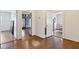 Hallway featuring hardwood floors and doorways leading to different rooms at 105 S Palmetto St, Summerville, SC 29483