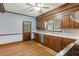 Traditional kitchen featuring wood cabinets, stainless steel appliances, hardwood floor and a view to the backyard at 105 S Palmetto St, Summerville, SC 29483