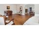 Open-concept living room with hardwood floors flowing into the dining area, perfect for entertaining and relaxation at 105 S Palmetto St, Summerville, SC 29483