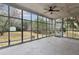 Spacious sunroom with concrete floor and views of the backyard at 105 S Palmetto St, Summerville, SC 29483