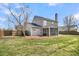 The expansive backyard includes a fire pit, screened in porch and plenty of space to relax at 105 Waylon Dr, Summerville, SC 29483
