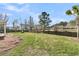 Enjoy a private backyard with mature trees, access to a pond, and a charming fire pit at 105 Waylon Dr, Summerville, SC 29483