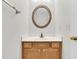 Well-lit bathroom with vanity, oval mirror, and traditional fixtures at 105 Waylon Dr, Summerville, SC 29483