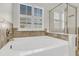 Bright bathroom featuring a soaking tub and a glass shower at 105 Waylon Dr, Summerville, SC 29483