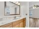 Spacious bathroom featuring a granite vanity and an ornate framed mirror at 105 Waylon Dr, Summerville, SC 29483