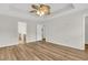 Large bedroom features modern ceiling fan, wood flooring, and ensuite bathroom at 105 Waylon Dr, Summerville, SC 29483