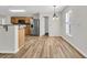 Bright kitchen features stainless steel refrigerator, wood cabinets, and stylish granite countertops at 105 Waylon Dr, Summerville, SC 29483