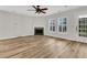 Bright and airy living room showcasing hardwood floors, a fireplace, and natural light at 105 Waylon Dr, Summerville, SC 29483