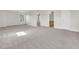 Spacious living room features neutral paint and plush carpeting and access to other rooms in the home at 105 Waylon Dr, Summerville, SC 29483