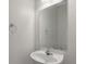 Powder room featuring a pedestal sink, mirror, and chrome fixtures at 113 Broad River Dr, Summerville, SC 29485