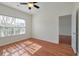 Bedroom with a large window, neutral walls and wood-look flooring at 113 Broad River Dr, Summerville, SC 29485