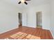 Bright bedroom with ceiling fan, wood-look floors, and access to bath at 113 Broad River Dr, Summerville, SC 29485