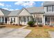 Charming single-story home featuring neutral siding, a covered porch, and well-maintained landscaping at 113 Broad River Dr, Summerville, SC 29485