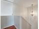 Hallway with hardwood floor, chandelier and a window for ample natural light at 113 Broad River Dr, Summerville, SC 29485