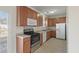 Well-lit kitchen with stainless appliances, tile backsplash, and laminate counters at 113 Broad River Dr, Summerville, SC 29485