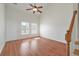 Bright living room features wood floors, a high ceiling, a fan, and lots of natural light at 113 Broad River Dr, Summerville, SC 29485