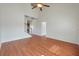Bright living room features wood floors, a high ceiling, and access to other rooms in the home at 113 Broad River Dr, Summerville, SC 29485